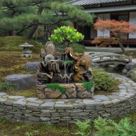 Tafelwaterornament – Kiezelwand Tuin & Kristallen Bol