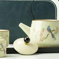 Reis-theepotset en twee kopjes - Blauwe Vogel Qing-dynastie